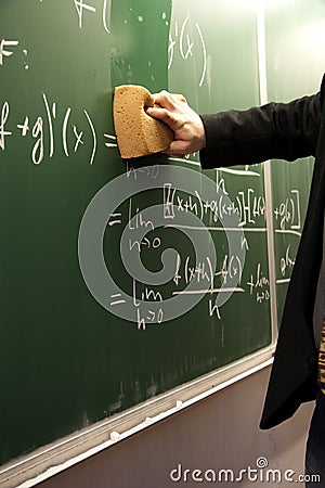 Erasing a blackboard Stock Photo
