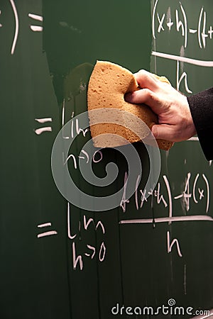 Erasing a blackboard Stock Photo