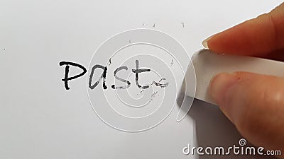 A hand erasing off the word PAST Stock Photo