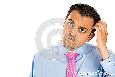 Erdy, idiot, dork, fool scratching his head in deep thought Stock Photo