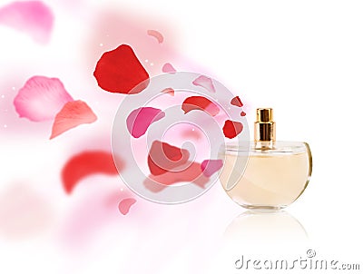 Erfume bottle spraying rose petals Stock Photo