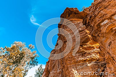 Eroding orange sandstone cliffs. Stock Photo