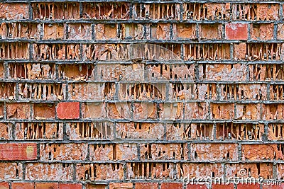 erosion, weathering and eolation of red brick walls Stock Photo