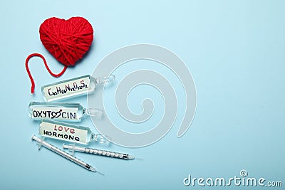 Erotic oxytocin hormone in ampoules. Love and pregnancy. Copy space for text Stock Photo