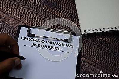 Errors & Omissions Insurance write on paperwork isolated on wooden table Stock Photo