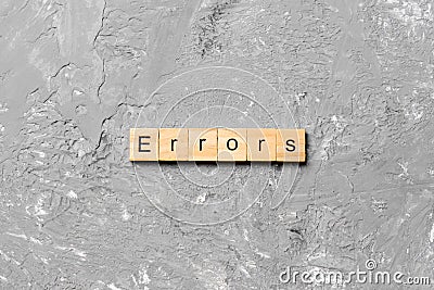 Errors word written on wood block. Errors text on cement table for your desing, concept Stock Photo