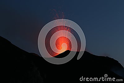 Erupting volcano with Strombolian type eruption Stock Photo