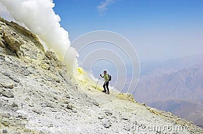 Man standing near volcanic vent on top of Damavand volcano , Iran Editorial Stock Photo