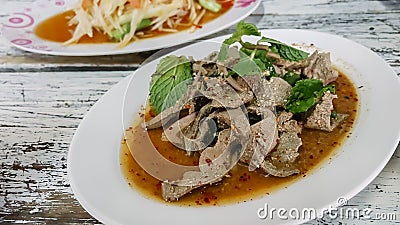 Esan`s food, Scalding Liver pork with spicy garnish in dish on Stock Photo