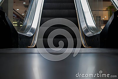 Escalator in Community Mall, Shopping Center. Moving up staircase. electric escalator. Close up to escalators. Close up floor Stock Photo