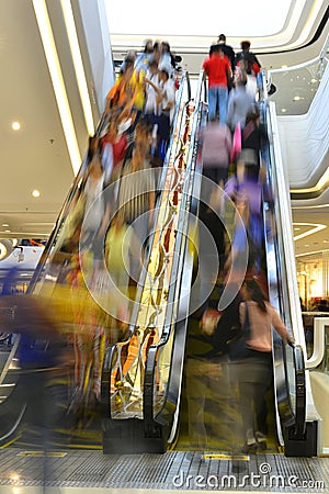 Escalator elevator channel corridor passageway lift hurried travelers Stock Photo