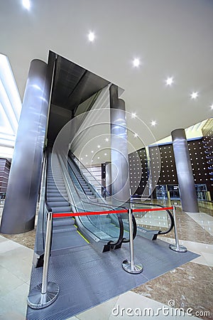 Escalator in hall which is closed barrier Stock Photo