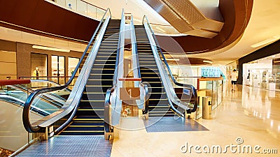 Escalator in shopping mall Stock Photo