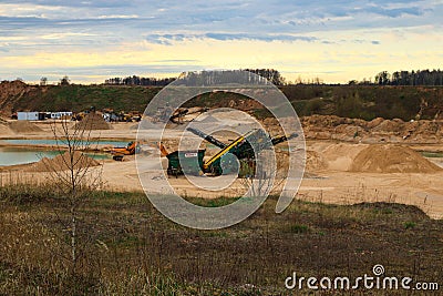 Escalators, tractors and bulldozers work in large careers Stock Photo