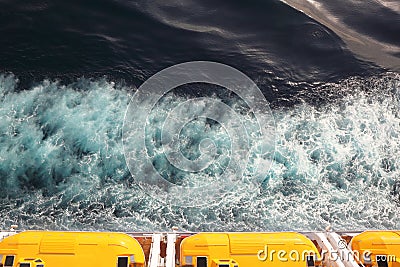 Escape boats with yellow roof on cruise ship Stock Photo