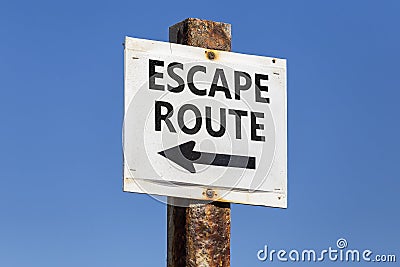 Escape route word and arrow signpost Stock Photo