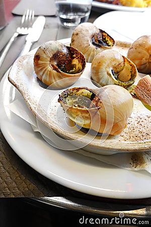 Escargots snails in french restaurant cafe Stock Photo