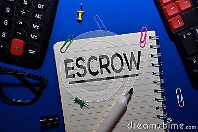 ESCROW write on book isolated on wooden table. Medical or Finance concept Stock Photo