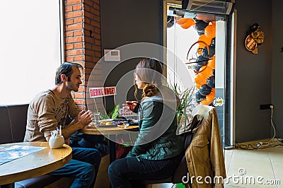 Eskisehir, Turkey - April 15, 2017: Couple sitting at cafe table. Editorial Stock Photo