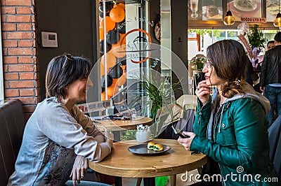 Eskisehir, Turkey - April 15, 2017: Friends sitting in cafe shop Editorial Stock Photo