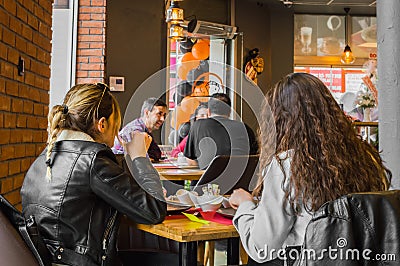 Eskisehir, Turkey - April 15, 2017: Friends sitting in cafe shop Editorial Stock Photo