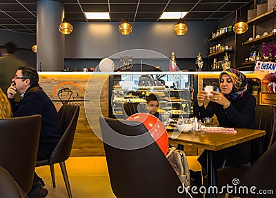 Eskisehir, Turkey - April 15, 2017: People sitting in a cafe shop Editorial Stock Photo