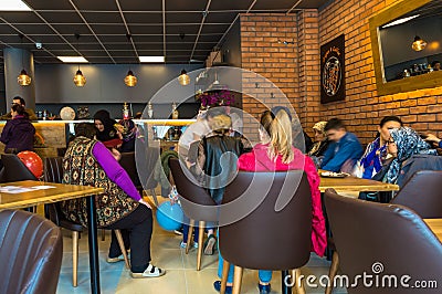 Eskisehir, Turkey - April 15, 2017: People sitting in a cafe shop Editorial Stock Photo