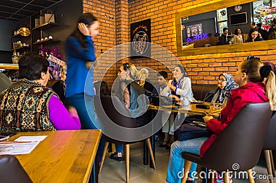 Eskisehir, Turkey - April 15, 2017: People sitting in a cafe shop Editorial Stock Photo