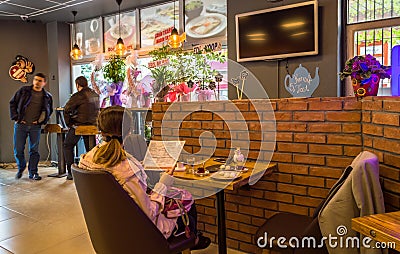 Eskisehir, Turkey - April 15, 2017: People sitting in a cafe shop Editorial Stock Photo