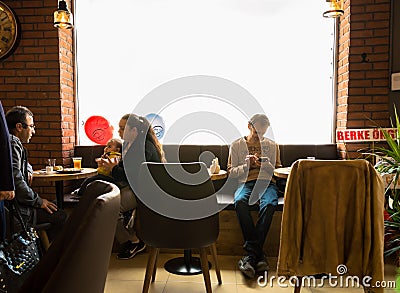 Eskisehir, Turkey - April 15, 2017: People sitting in a cafe shop Editorial Stock Photo