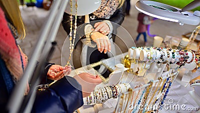 Esoteric and colorful background. Gemstone bracelets and necklaces. Healing, powerful crystal and stones energy. Stock Photo