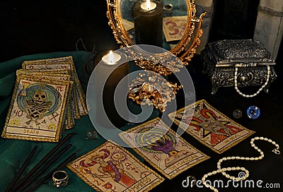 Esoteric still life with the Tarrot cards, mirrow and crystals Stock Photo