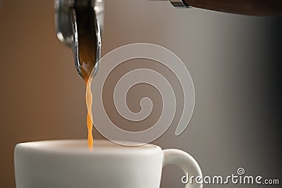 Espresso brewing with single spout portafilter on professional coffee machine Stock Photo