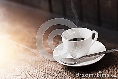 Espresso Coffee or Americano black Coffee in White cup on wood table Stock Photo