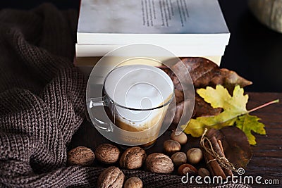 Espresso coffee in glass cup on autumn decorated desk Stock Photo