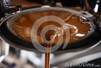 Espresso extraction with bottomless portafilter Stock Photo