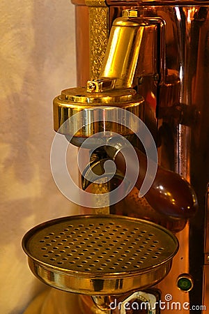 Espresso spout and brewing group on vintage steampunk looking coffee Espresso machine Stock Photo