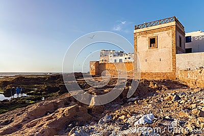 ESSAOUIRA, MOROCCO - JUNE 08, 2017: View of the historical walls of the Essaouira fortress and volcanic shore of the Atlantic Editorial Stock Photo
