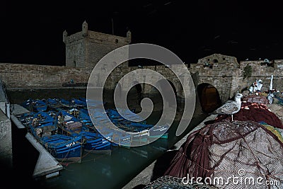 Essaouira port in Morocco. Blue fishing boats of Essaouira at night Editorial Stock Photo