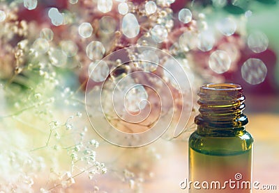 Essence bottle and colorful bokeh Stock Photo