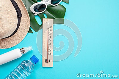 Essential accessories for summer heat: sunglasses, hat, sunscreen, bottle of water. Flat lay, top view Stock Photo