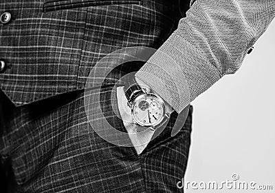 Essential accessory in any menswear collection. Luxury watch worn on male wrist. Classic timepiece. Fashion accessory Stock Photo