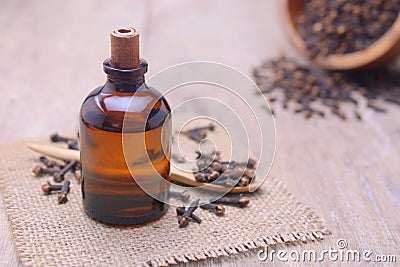 Essential aroma clove oil in a glass bottle. Stock Photo