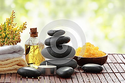 Essential oil , candle, towel and stones for teraphy Stock Photo