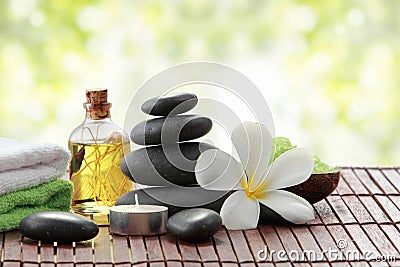 Essential oil , candle, towel and stones for teraphy Stock Photo