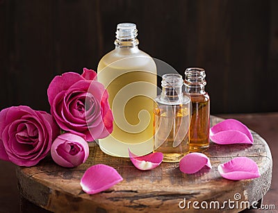 Essential oil and rose flowers aromatherapy spa perfumery Stock Photo