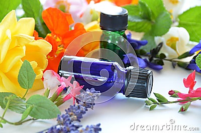 Essential oils with herbal flowers Stock Photo