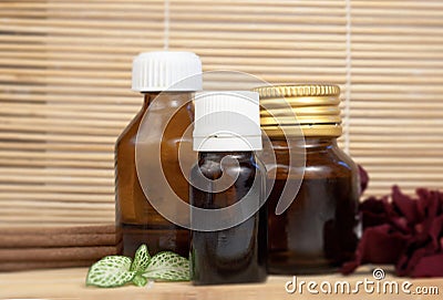 Essential oils rose petals and aroma sticks for spa Stock Photo