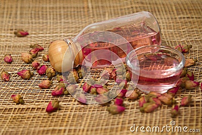 Essential rose oils and dried rose Stock Photo