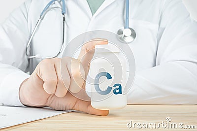 Essential supplement calcium Ca for bone humans. doctor recommends taking calcium. doctor talks about Benefits of calcium. Calcium Stock Photo